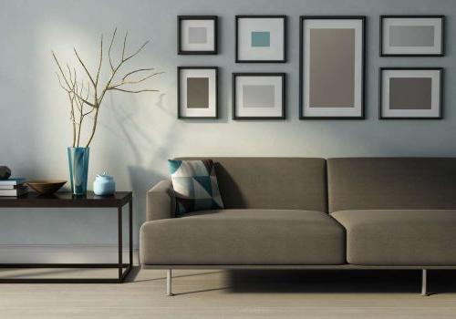 客厅 with modern interior, beige sofa, frames and a table at Overlook apartments for rent