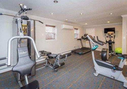 Fitness center with exercise equipment at Rosedale Court apartments for rent in Abington, PA