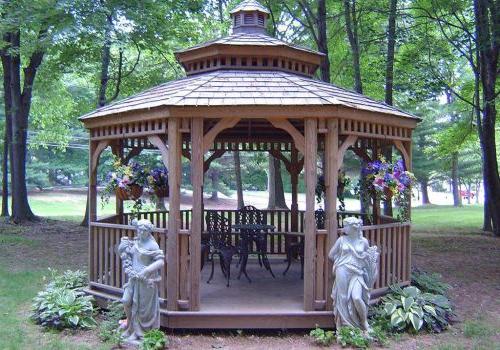 Gazebo with statues, a seating area, and flowers at The Park at Westminster apartments for rent