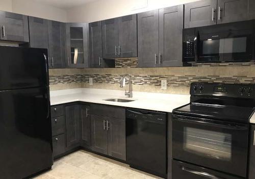 Kitchen with black appliances at The Park at Westminster apartments for rent in Warrington, PA