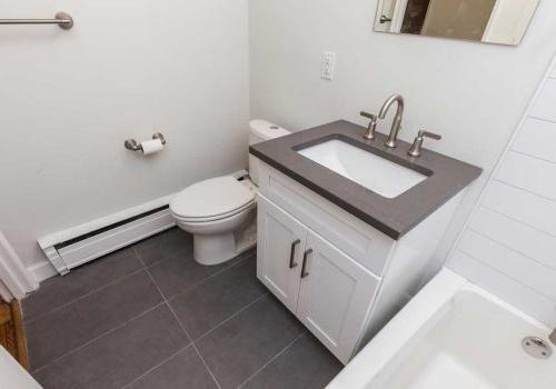 Updated bathroom with subway tiling at Sedgwick Terrace apartments in West Mt. Airy, Philadelphia.