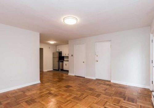 Open concept living and dining room with hardwood floors at Sedgwick Terrace apartments for rent.